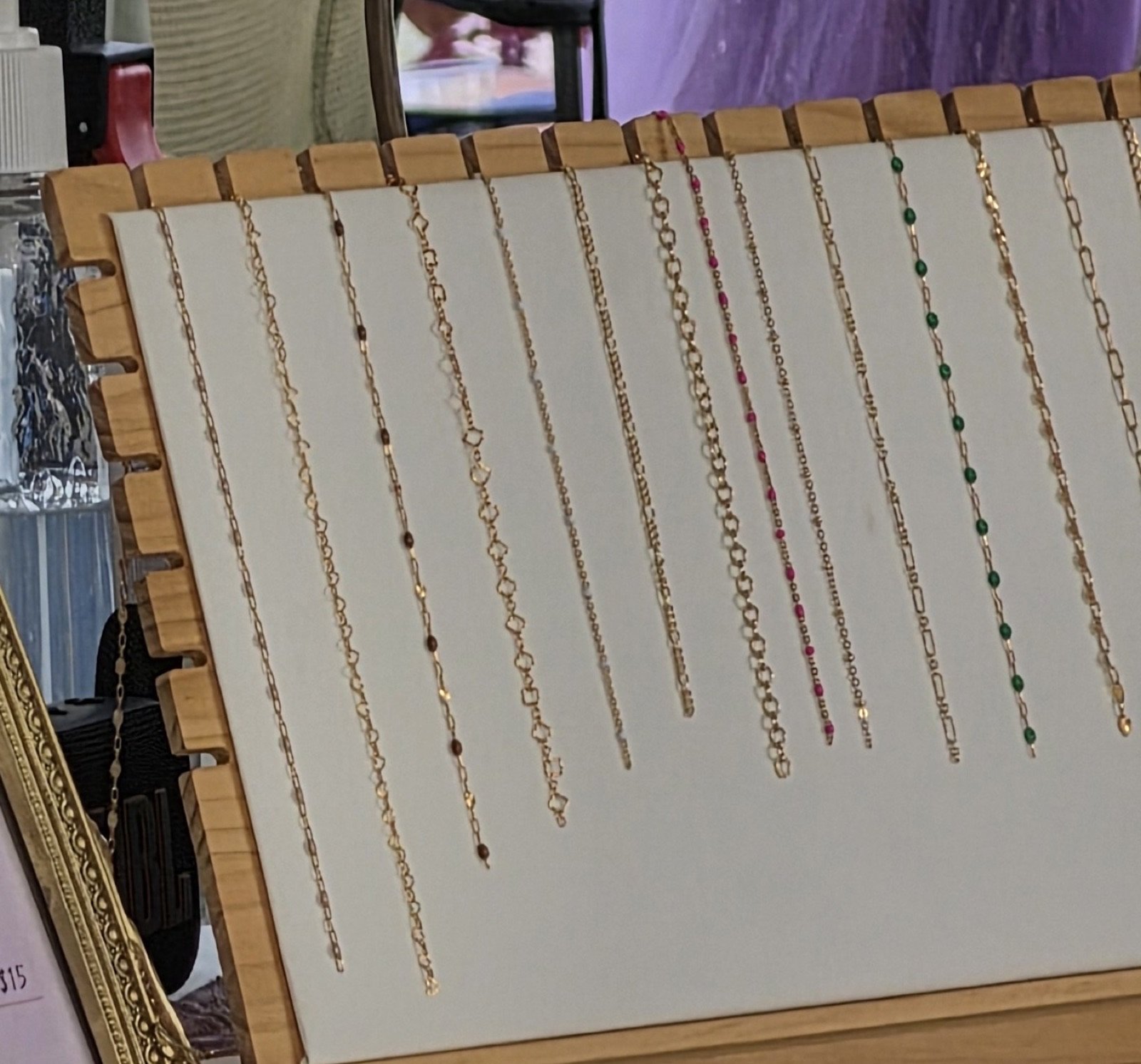 Gold chains on a linen display board